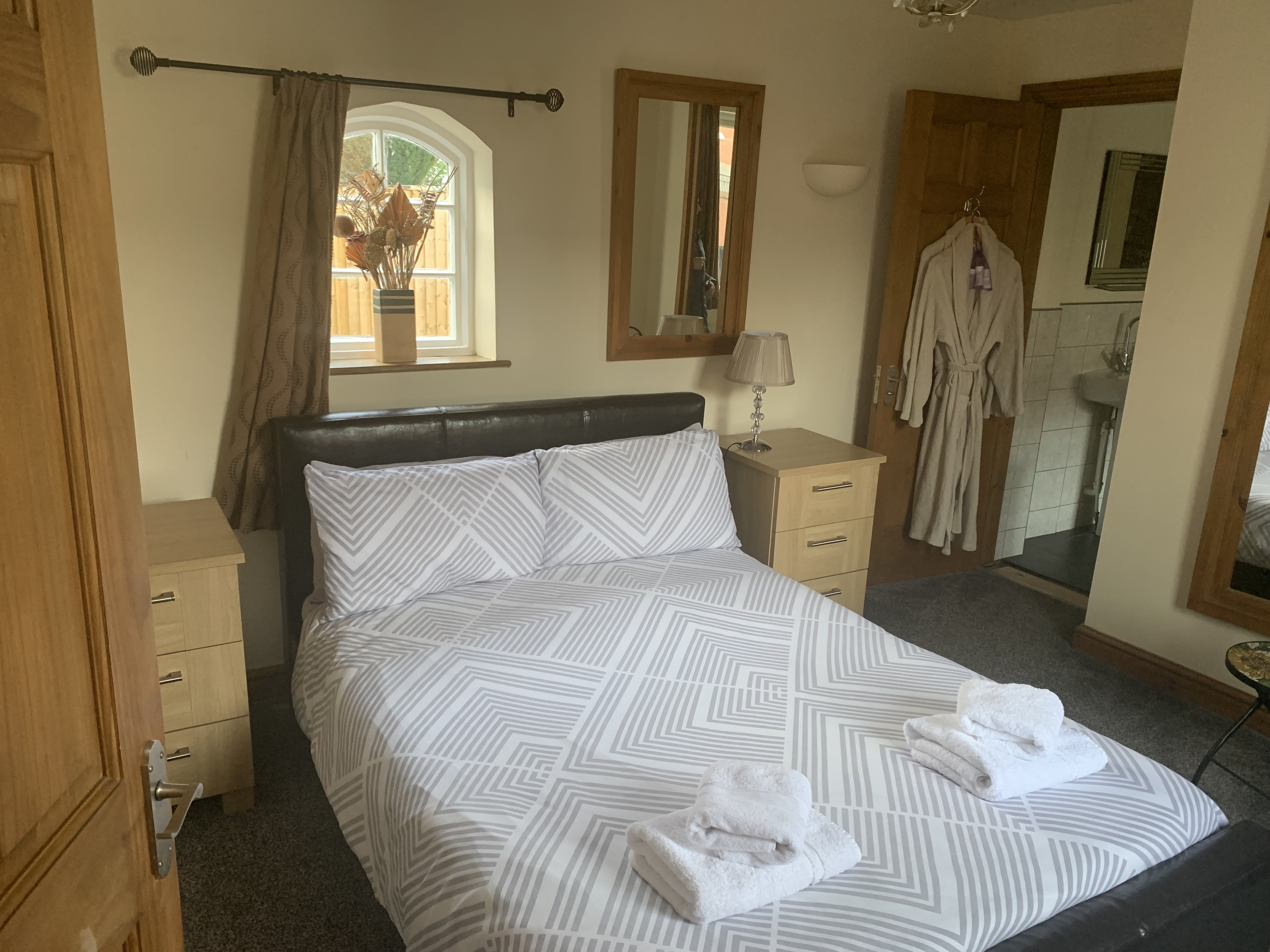 Double bed in cottage bedroom
